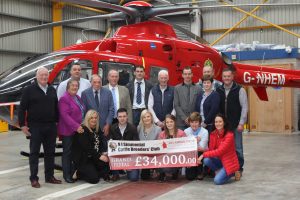 Office bearers and committee members of the NI Simmental Cattle Breeders' Club recently visited the headquarters of Air Ambulance Northern Ireland to present a cheque for £34,000. Included are AANI trustee Rodney Connor, and the charity's head of fundraising Kerry Anderson. Picture: Julie Hazelton